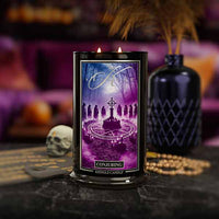 Decorative candle titled Conjuring with a mystical design on a dark background