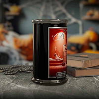 Halloween Candle with a red label featuring a religious design on a dark surface.
