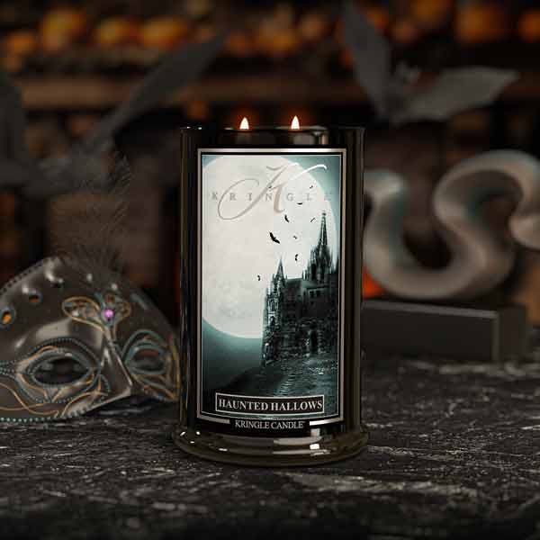 Haunted Hallows Candle with a haunted castle design on a dark background