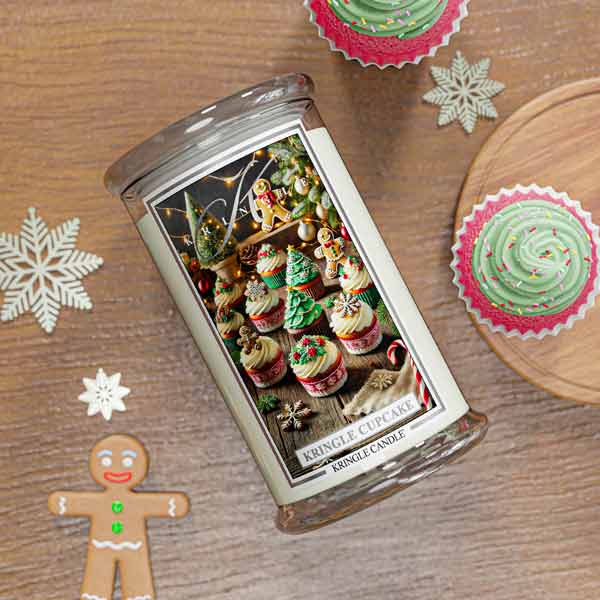 Christmas Cupcake Kringle Candle with Christmas cupcake design on a wooden surface with festive decorations.