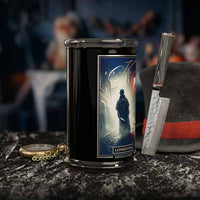 Black cylindrical container with a graphic design on a dark surface with tools, London Fog Halloween Candle.