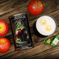 Halloween Candle named poison apple with red apples on a wooden surface