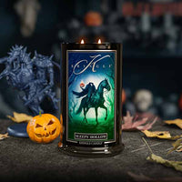 Kringle Candle with 'Sleepy Hollow' design on a Halloween-themed background