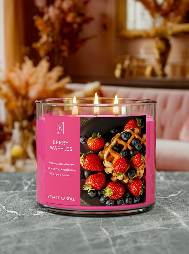 Kringle Candle with 'Berry Waffles' label with blueberries and strawberries and a fall background