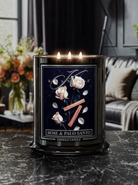 Kringle Candle with 'Rose & Palo Santo' fragrance on a dark surface with a blurred background