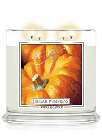 Kringle Candle Sugar Pumpkins 4-wick lit candle with a pumpkin design on the label.