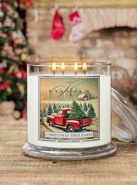 Kringle Candle with a Christmas tree farm design in front of a fireplace and Christmas tree.