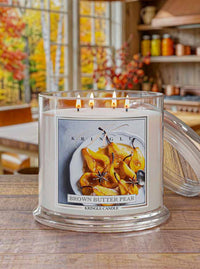 Kringle Candle with 'Brown Butter Pear' label on a wooden surface