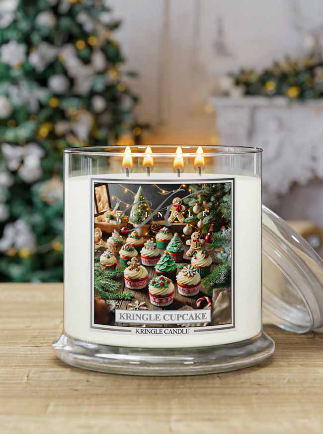 Kringle Candle with festive design in front of a decorated Christmas tree