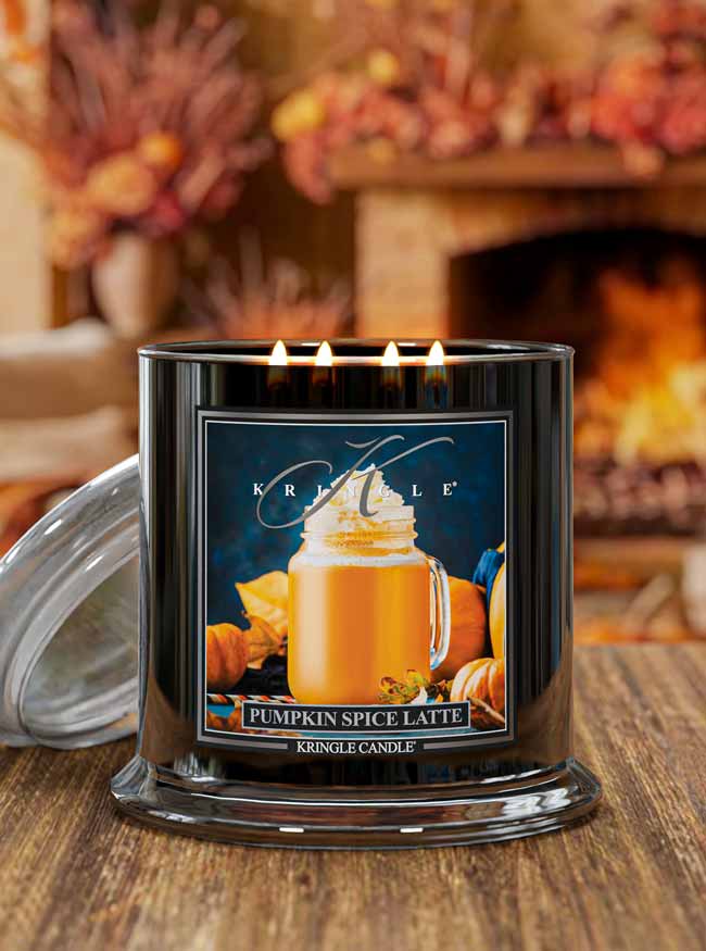 Kringle Candle pumpkin spice latte candle on a wooden surface with a blurred background