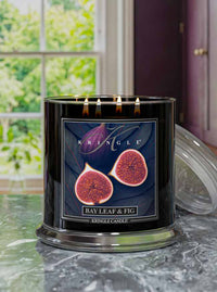 Kringle Candle with 'Bay Leaf & Fig' label on a kitchen counter surface with a window in the background
