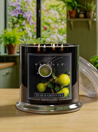Kringle Candle with pear and green tea label on a wooden surface