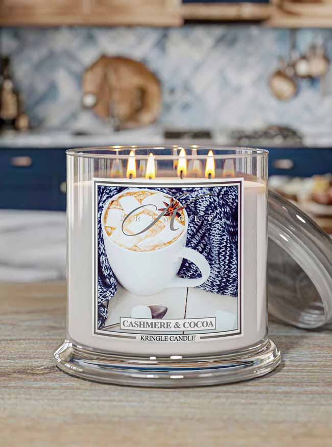 Kringle Candle labeled 'Cashmere & Cocoa' in a kitchen setting