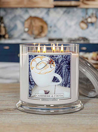Kringle Candle labeled 'Cashmere & Cocoa' in a kitchen setting