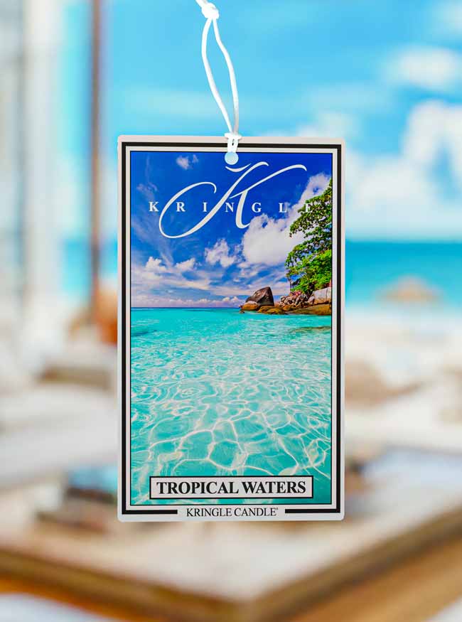 Kringle Candle Tropical Waters air freshener with a scenic background