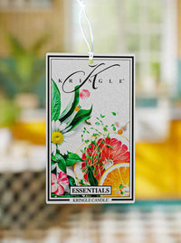 Kringle Candle air freshener tag with floral design on a blurred background