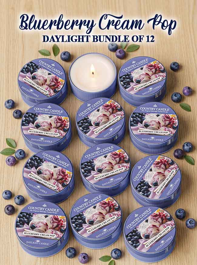 Collection of 12 Country Candle Bluerberry Cream Pop daylight candles on a wooden surface with blueberries.