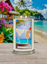 Kringle Candle with 'Cosmic Cupcakes' design on an outdoor ocean background