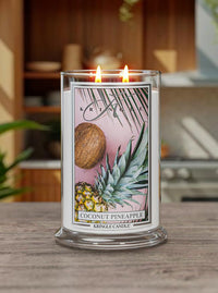Kringle Candle with coconut and pineapple design on a wooden surface