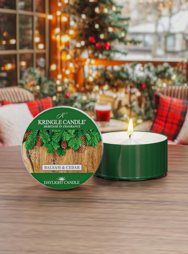 Kringle Candle daytime candle with packaging on a table in a festive setting