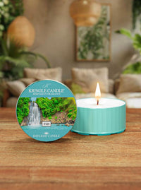 Kringle Candle Fiji daylight candle on a wooden surface with a scenic label