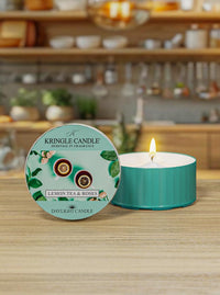 Kringle Candle lemon tea & roses DayLight candle on a wooden surface