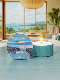 Kringle Candle Seaside daylight candle on a table with a scenic background
