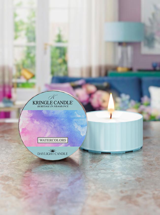 Kringle Candle daylight candle with colorful label on a table in a home setting