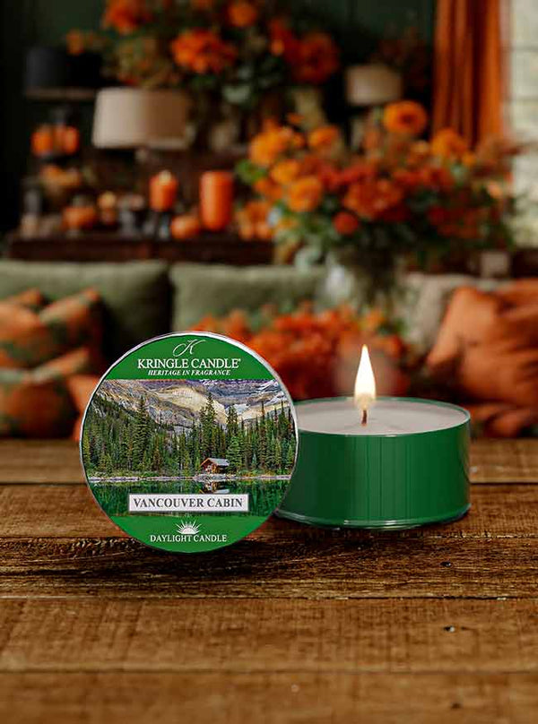 DayLight candle featuring a scenic label of a lakeside cabin surrounded by trees and mountains,  "Vancouver Cabin"