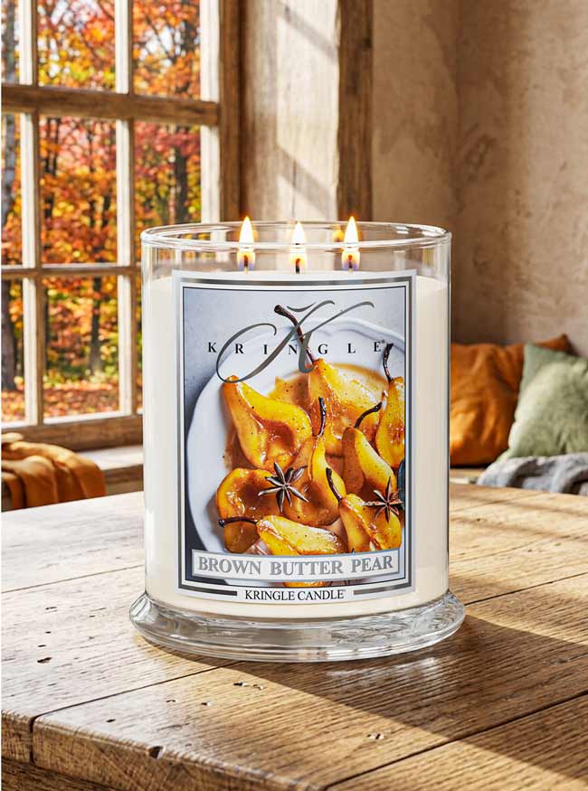 Brown Butter Pear Candle by Kringle Candle on a wood dining room table with fall decor