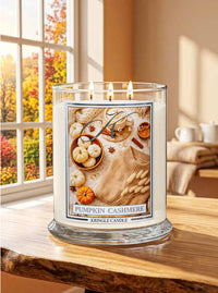 Kringle Candle with a label featuring small pumpkins, cinnamon and sweater in a fall decorated room