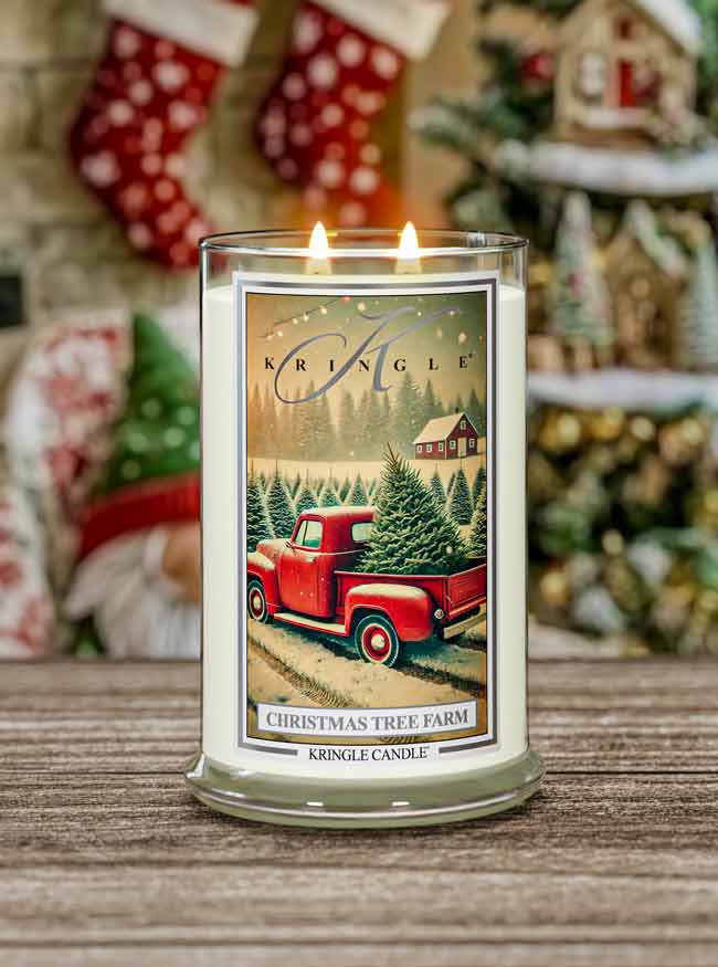 Kringle Candle with Christmas Tree Farm design on a wooden surface with festive background