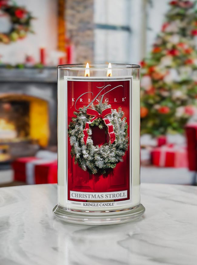 Kringle Candle with Christmas wreath design in a festive setting