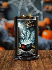 Kringle Candle 'Chest of Chaos' on a wooden surface with Halloween-themed decorations in the background.
