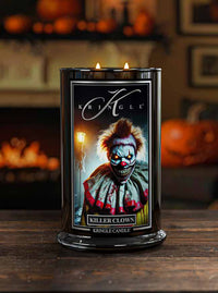 Kringle Candle with a 'Killer Clown' design on a wooden surface with pumpkins in the background.