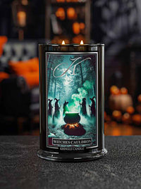 Kringle Candle 'Witches' Cauldron' candle with a mystical design on a dark background