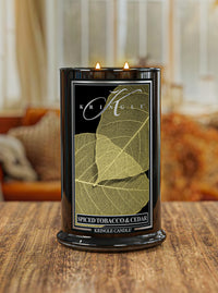 Kringle Candle with leaf design on a wooden surface