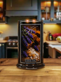 Cedar Veil Candle with a decorative label on a wooden surface in a kitchen setting