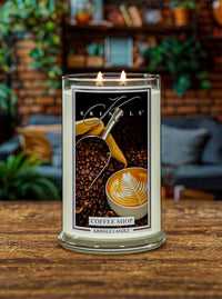 Kringle Candle with 'Coffee Shop' design on a wooden surface