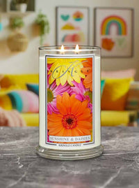 Kringle Candle labeled 'Sunshine & Daisies' on a marble surface with colorful background