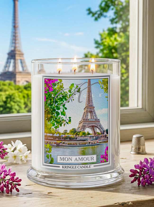 Kringle Candle with Eiffel Tower design in front of the Eiffel Tower