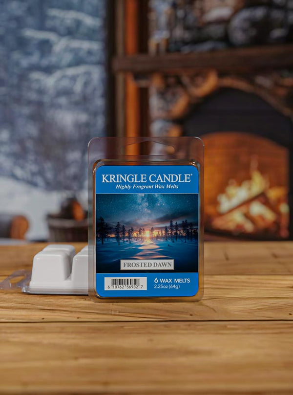 Kringle Candle Frosted Dawn wax melts packaging with a scenic label on a blurred living room background