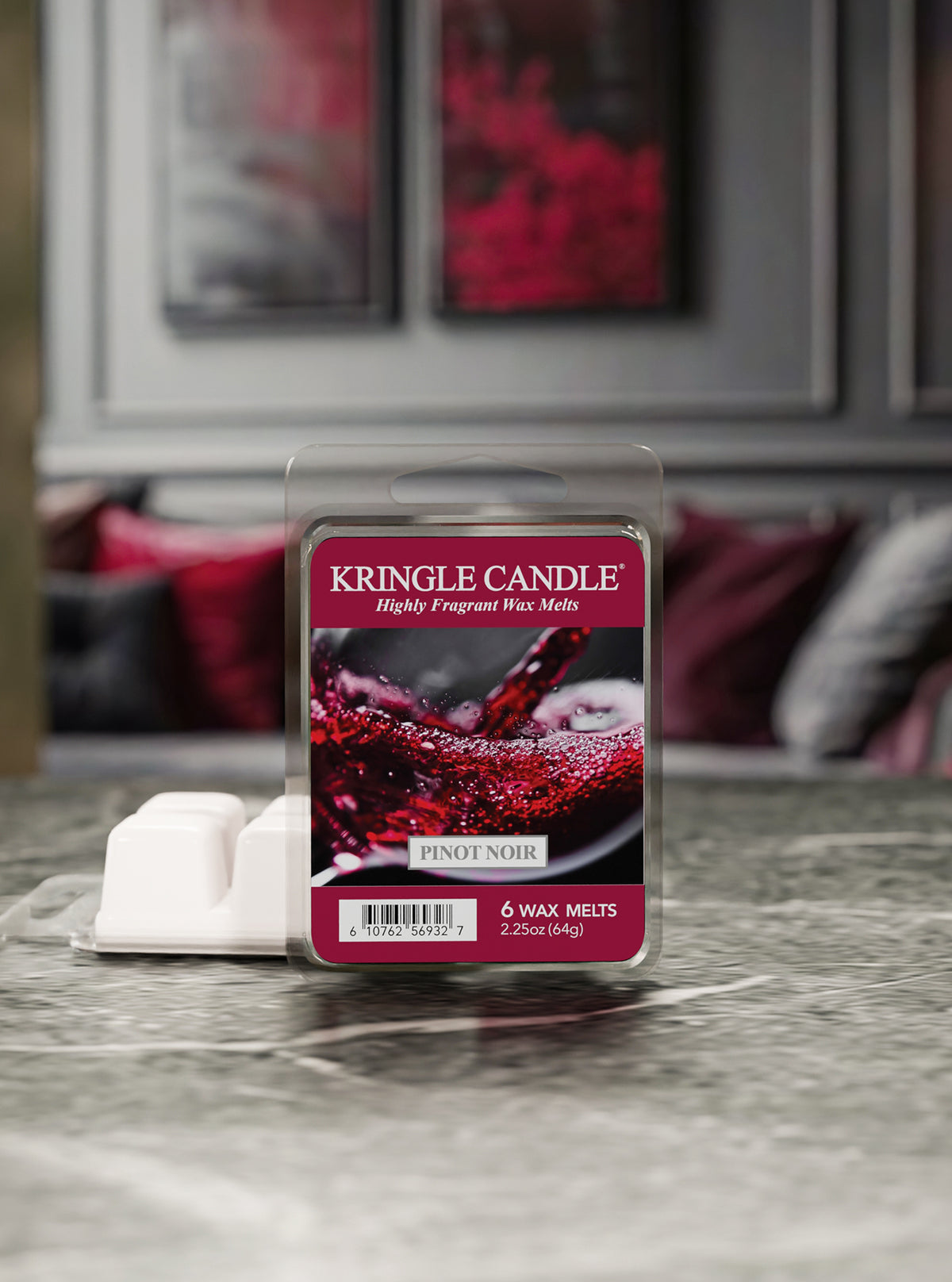 Kringle Candle Pinot Noir wax melt package on a surface with a blurred background