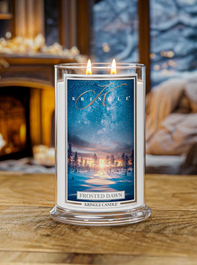 Kringle Candle 'Frosted Dawn' in front of a fireplace
