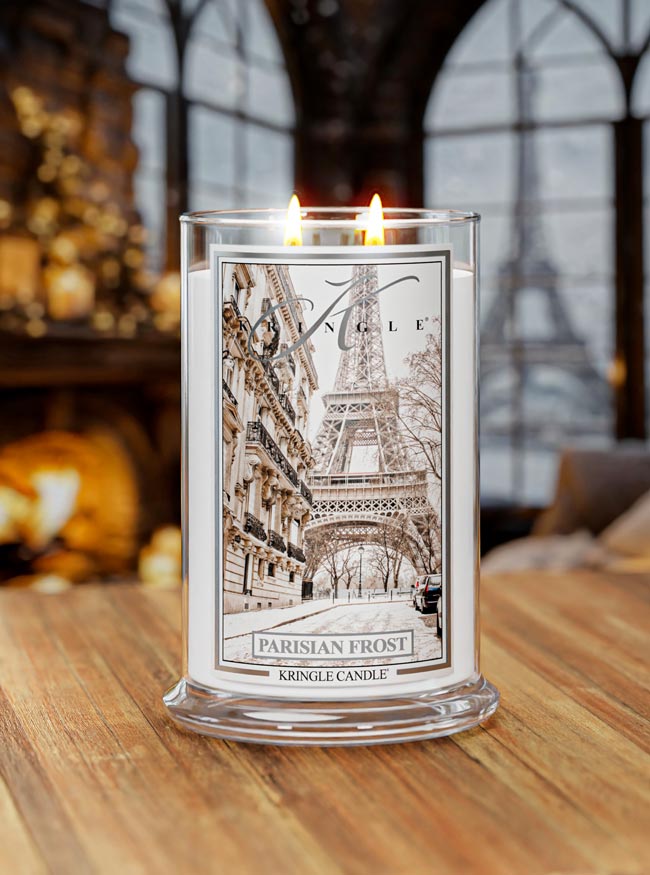 Kringle Candle with Eiffel Tower design on a wooden surface