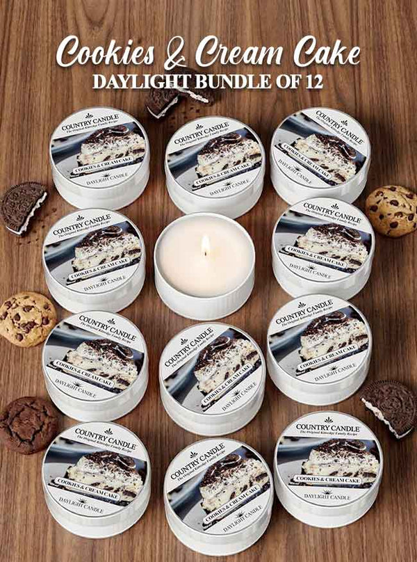 Cookies & Cream Cake candles on a wooden surface with packaging.
