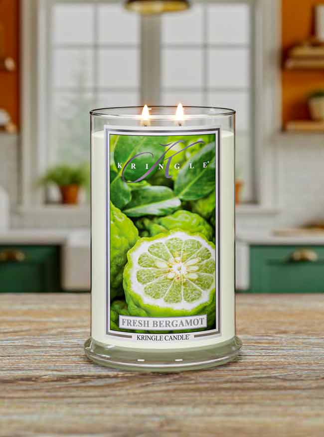 Kringle Candle with 'Fresh Bergamot' label on a wooden surface