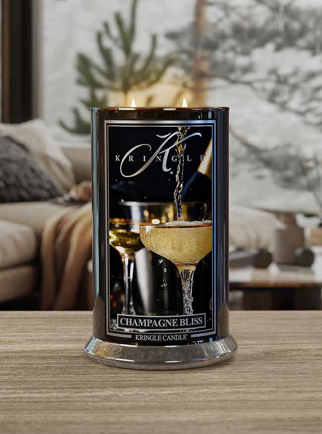 Large Champagne Bliss Reserve Collection Lit Candle in winter living room lifestyle setting - Kringle Candle Company