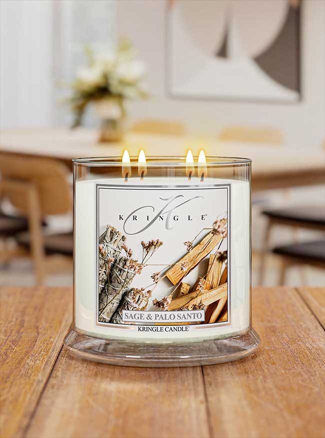 Kringle Candle with three flames on a wooden surface
