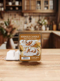 Kringle Candle wax melts packaging on a wooden surface with a blurred kitchen background